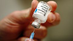 Image: File photo of a nurse preparing an injection of the influenza vaccin