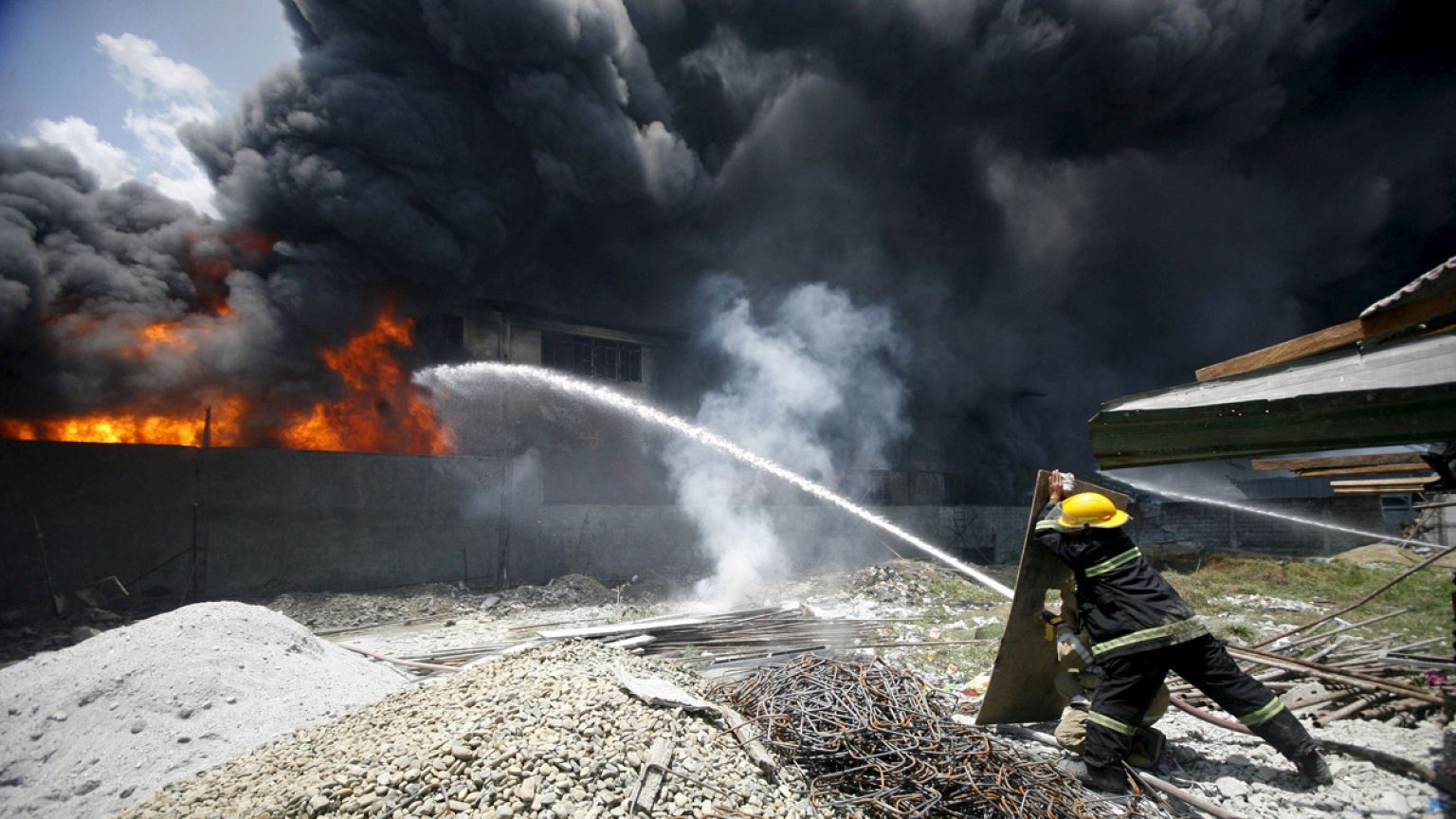 Fire kills dozens in Manila slipper factory fire
