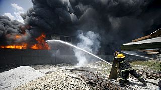 Fire kills dozens in Manila slipper factory fire