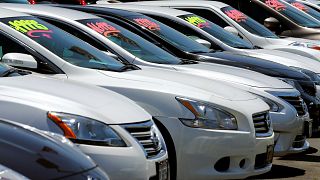 Image: Automobiles are shown for sale at a car dealership in Carlsbad, Cali