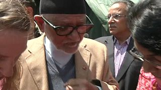 Nepalese PM visits quake zone and takes woman to hospital in his helicopter