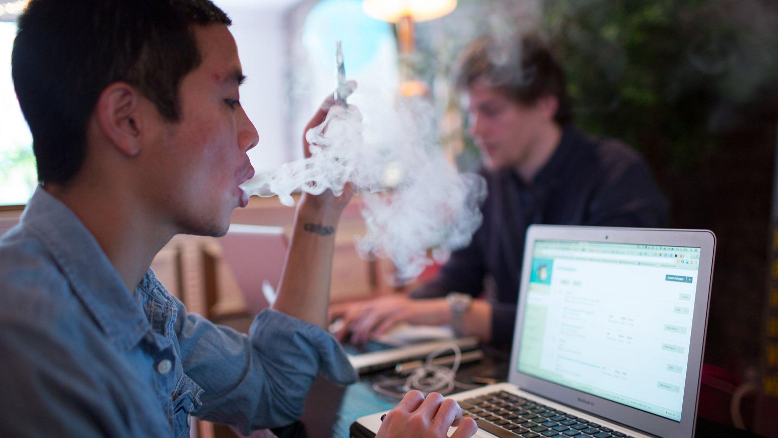 Image: E-cigarette smoker exhales vapor