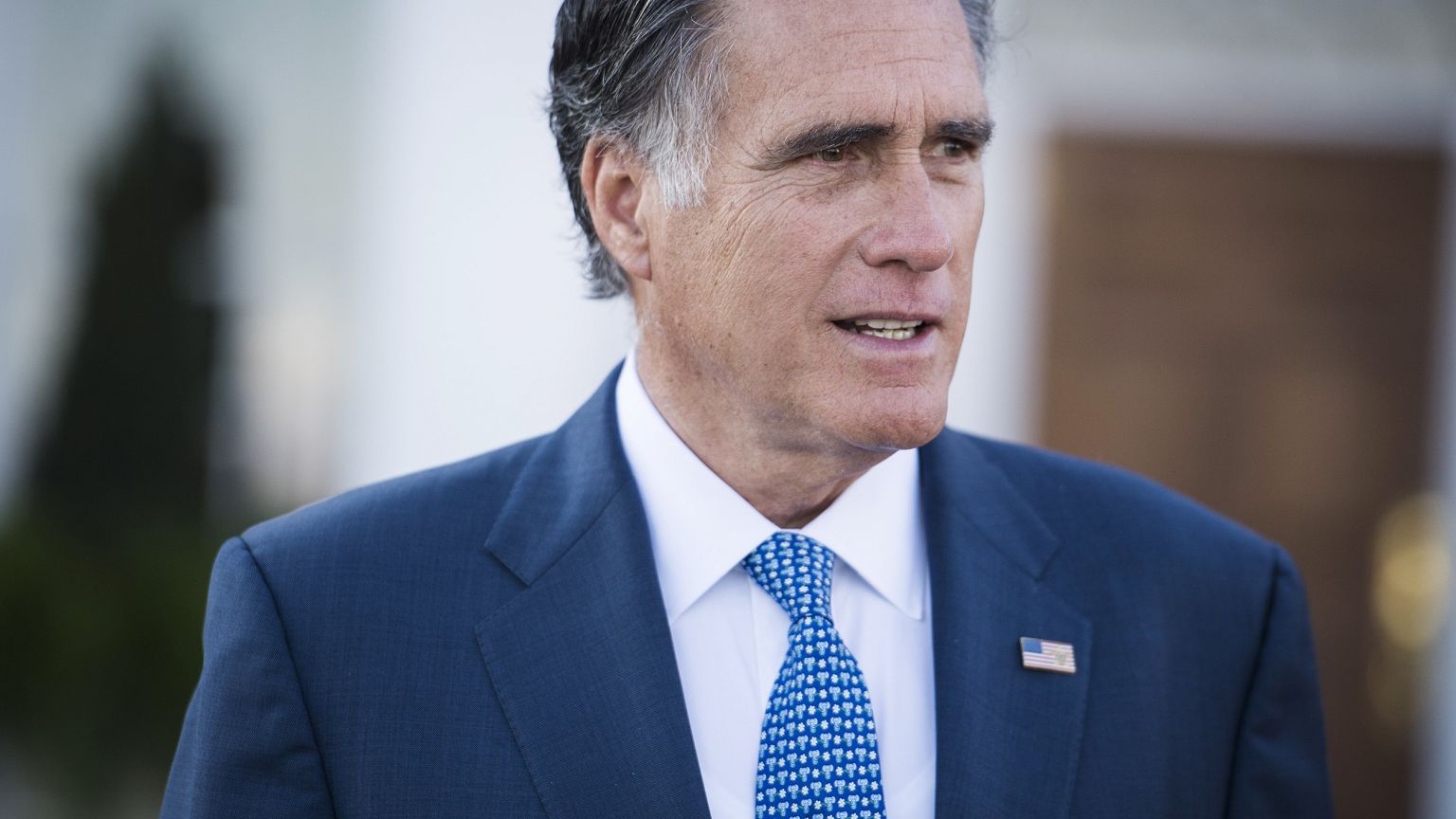 Image: Mitt Romney talks to the media after meeting with President-elect Do