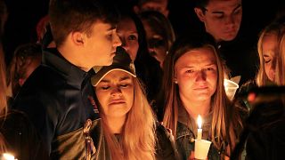 Image: People attend a vigil