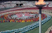 Image: Athletes from a 160 nations parade during the Olympics opening cerem