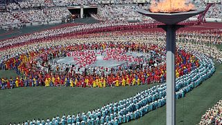 Image: Athletes from a 160 nations parade during the Olympics opening cerem