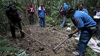 Dozens of suspected migrant graves found near Malaysia-Thailand border, police reveal