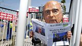 Protesters demand the resignation of FIFA's Blatter