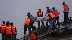 Relatives wait anxious for news after China ferry capsizes