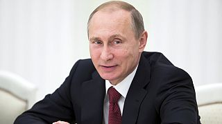 Absent from G7, Putin says Russia 'no threat' to West