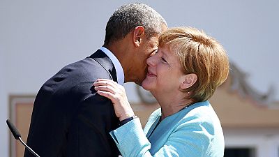 Aplausos para Obama e Merkel