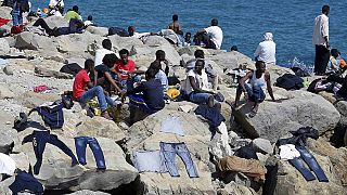 Migrants refuse to go away as French police prevent them crossing the Italian frontier