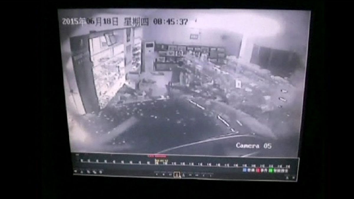 China: dizzy driver crashes car into a pharmacy