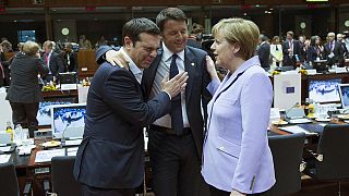 EU leaders agree migrant plan, while Greek debt deal remains elusive
