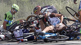 Horror crash mars Tour de France as Britain's Froome earns leader's yellow jersey