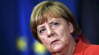 Merkel breaks off dealing with Greece to visit Balkans