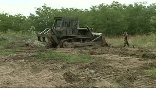 Hungary defies its critics and builds a barrier along its open border with Serbia