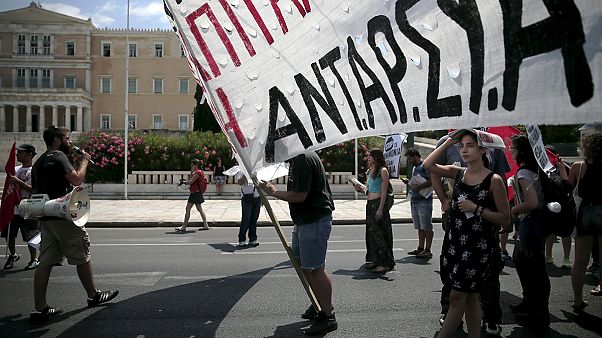 Greece: the politicians debate, the people protest. Greece: the politicians debate, the people protest.