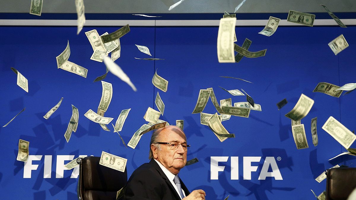 FIFA chief Blatter showered in fake bank-notes by prankster