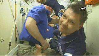 Soyuz capsule docks with space station