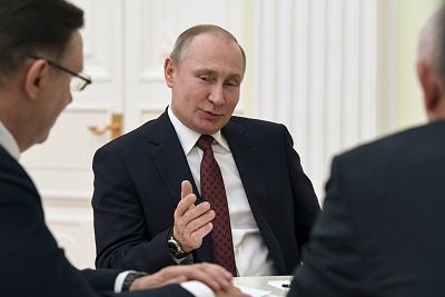 Vladimir Putin meets with co-chairs of his campaign office at the Kremlin in Moscow on Monday.