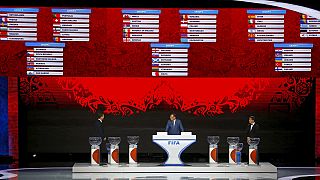 Business as usual as Blatter joins Putin for World Cup draw