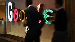 Image: People walk into Google's New York offices