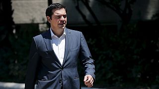 Greek PM attempts to keep his government together as new bailout talks begin