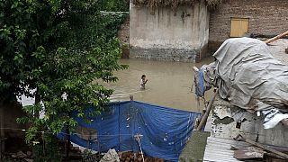 Dramatic footage of road collapse as deadly rain storms hit Asia