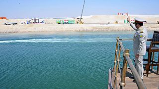 Egypt opens Suez Canal in lavish ceremony