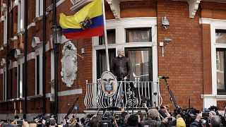 Image: WikiLeaks founder Julian Assange stands on the balcony of the Ecuado