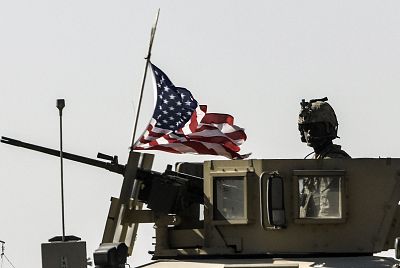A U.S. military convoy drives on a highway near Kobani, Syria, on Sept. 29, 2017.