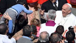 Image:Pope Francis meets a boy in the crowd after Easter Sunday mass at Vat