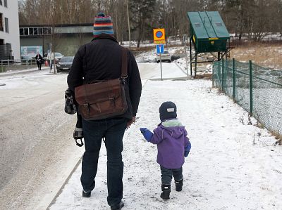 Michael Wells walks with his son in Stockholm, Sweden.
