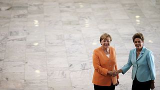 Merkel urges Brazil to open foreign competition