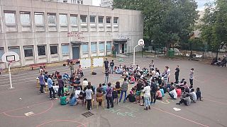 [In pictures] Paris migrants take over disused school