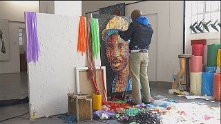 South African artist paints with fire and plastic waste