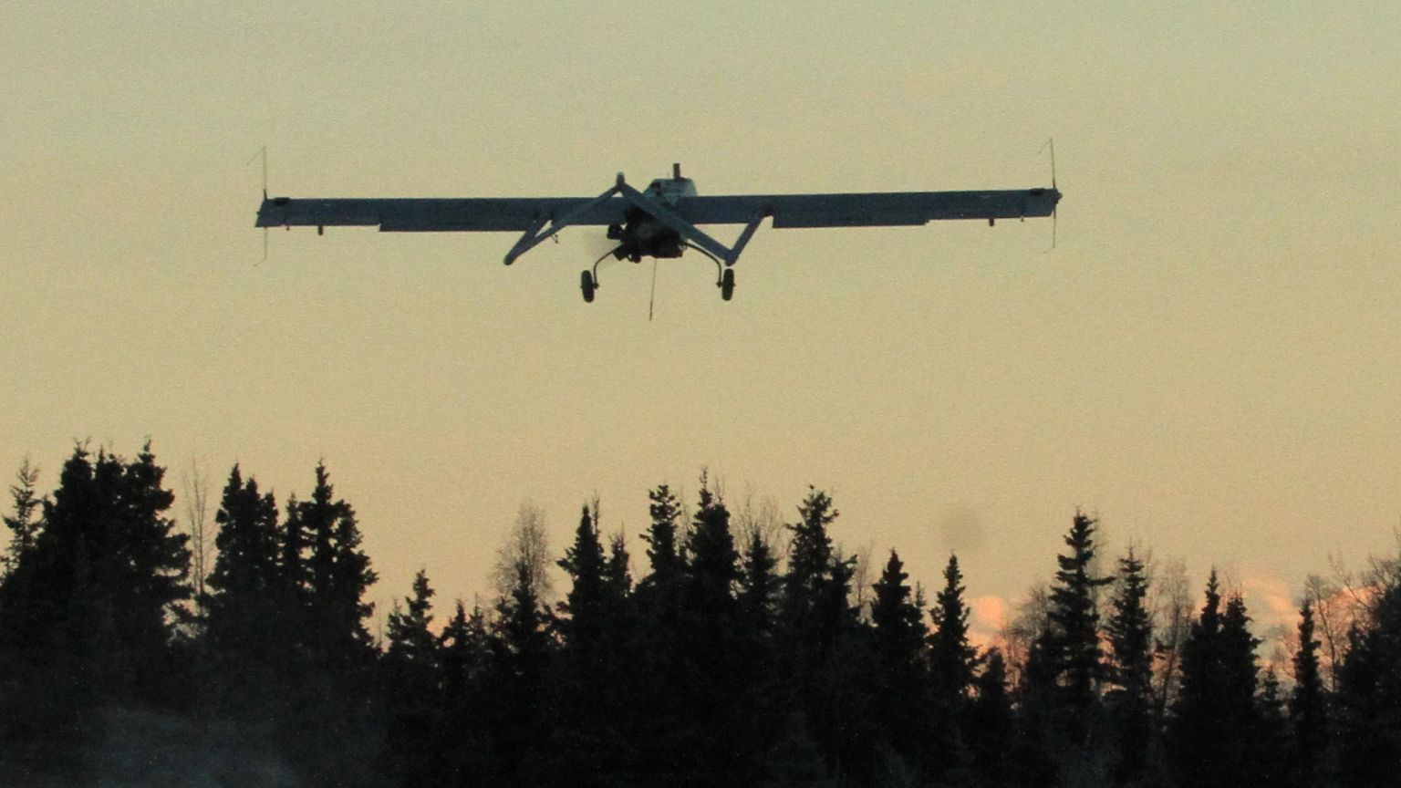 Image: An RQ7 Shadow aircraft ascends after its launch from a  pneumatic ca