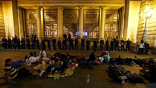 Stuck in Budapest: migrants bed down for second night outside railway station