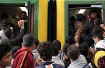Migrants cram trains as Hungary reopens station