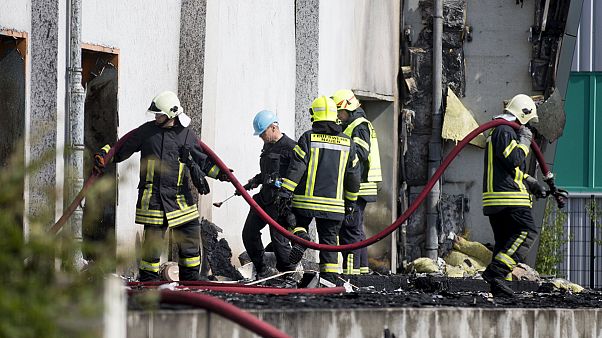 Five injured as fire tears through refugee shelter in Germany Five injured as fire tears through refugee shelter in Germany