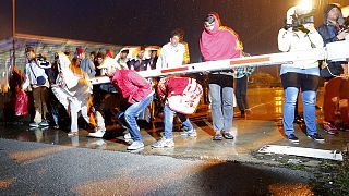 Relieved migrants cross Hungary-Austria border