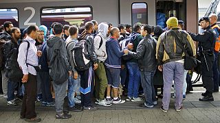 Migrants: Austrian rail suspends services to and from Hungary