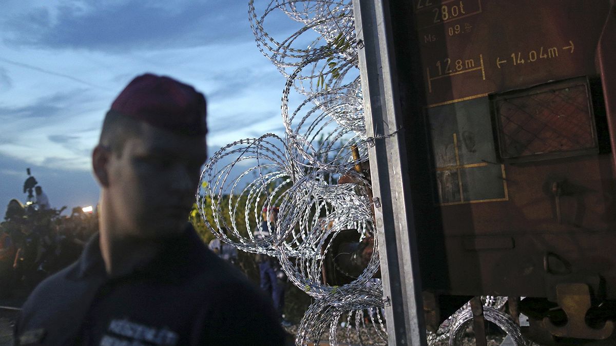 Hungary seals border with razor wire