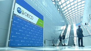 OECD says world economy set to grow less than estimated