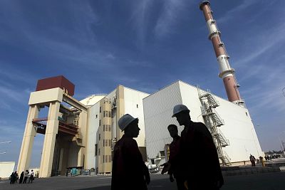 Workers stand in front of Iran\'s Bushehr nuclear power plant in 2010.