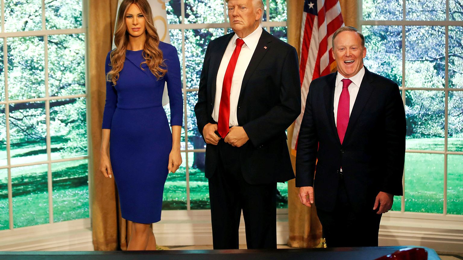 Image: Former White House Press Secretary Sean Spicer poses next to a newly