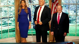 Image: Former White House Press Secretary Sean Spicer poses next to a newly