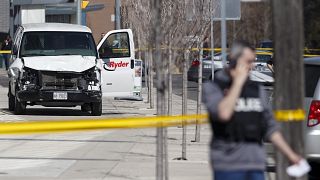 Image: Police inspect a van suspected of being involved in a collision inju