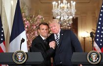Image: U.S. President Donald Trump and French President Emmanuel Macron hol